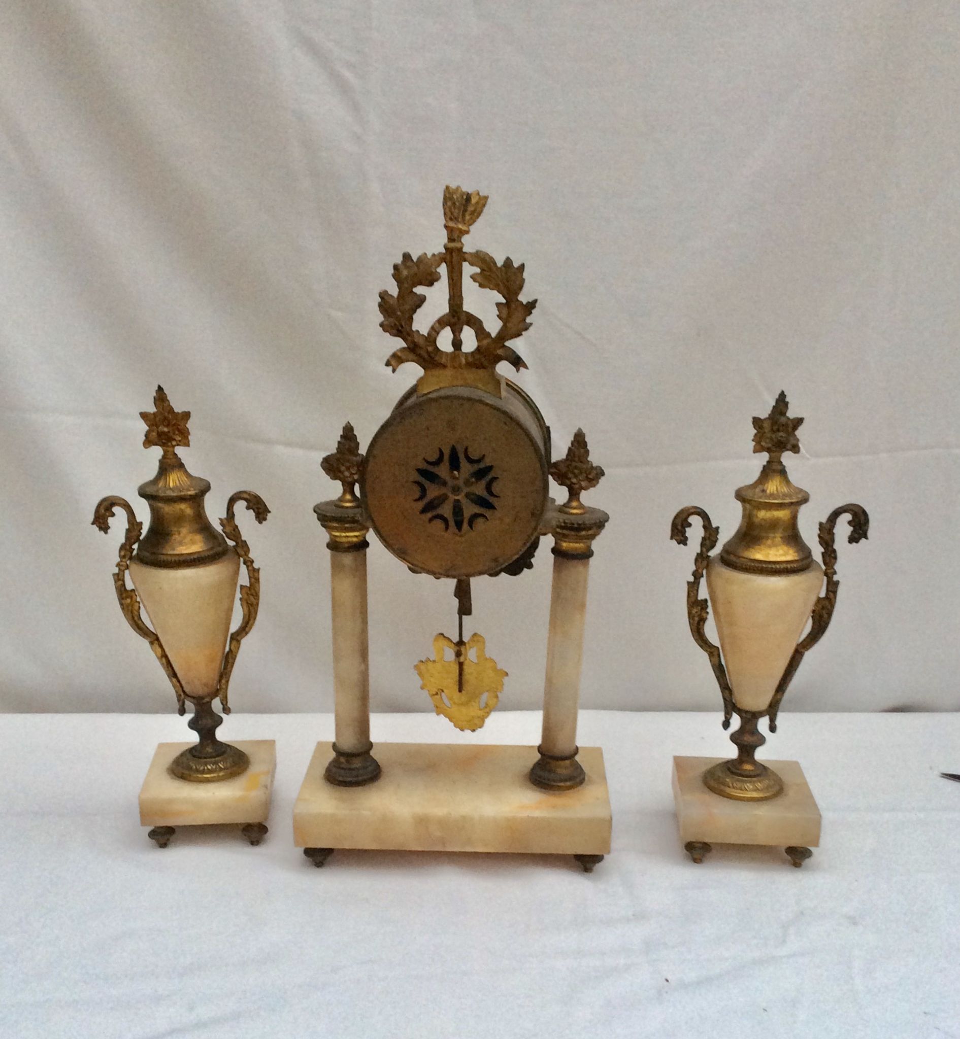Clock fireplace trim and two vases in onyx and bronze style Louis XVI