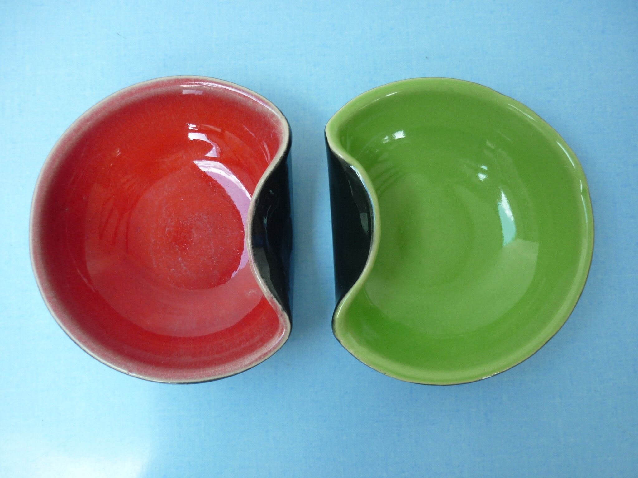 Set of two-colored red and green ceramic cuts on a black background