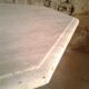 Octagonal table in travertine, 80s