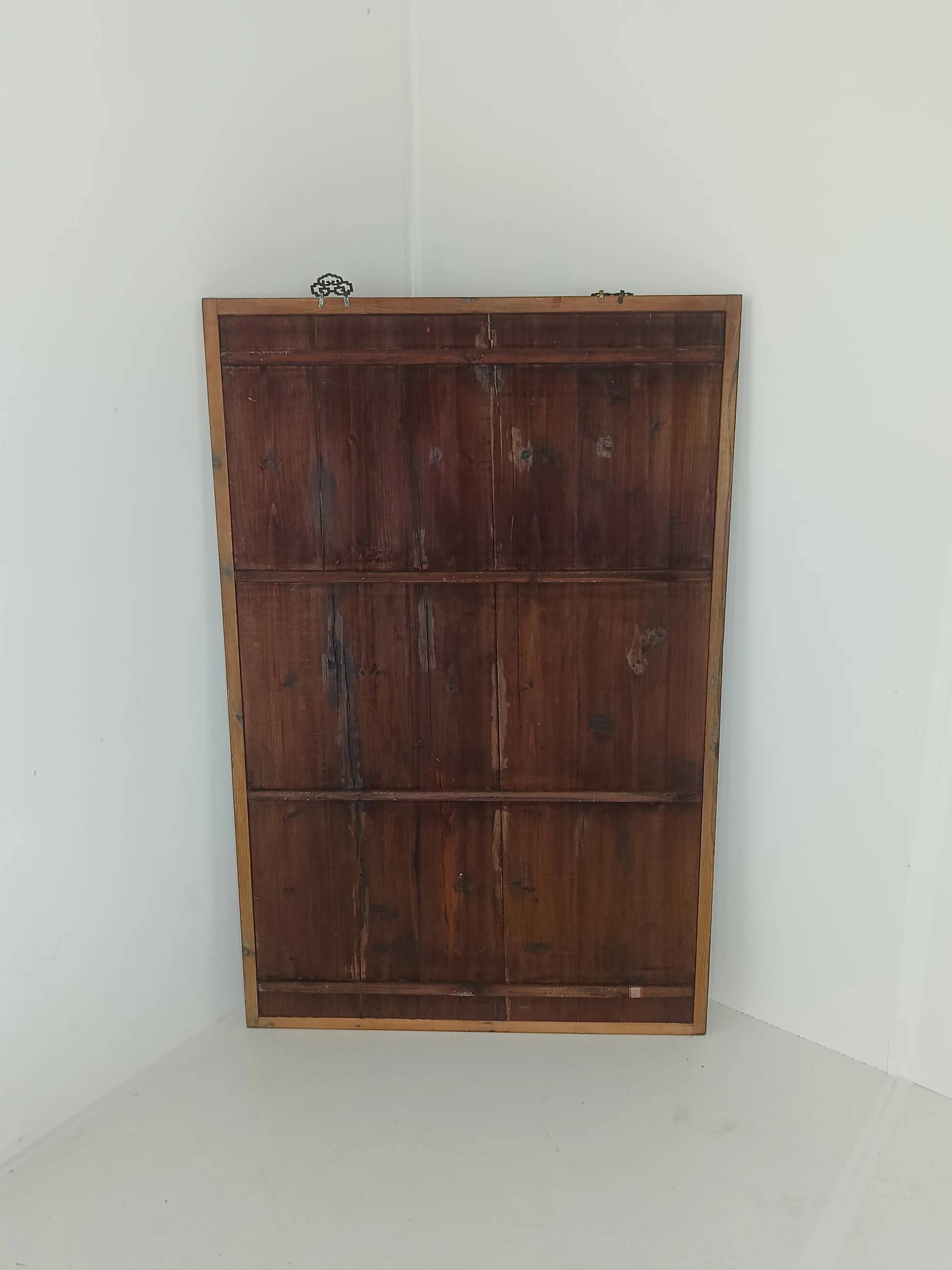 A framed Chinese ancestral portrait is a traditional hand-painted