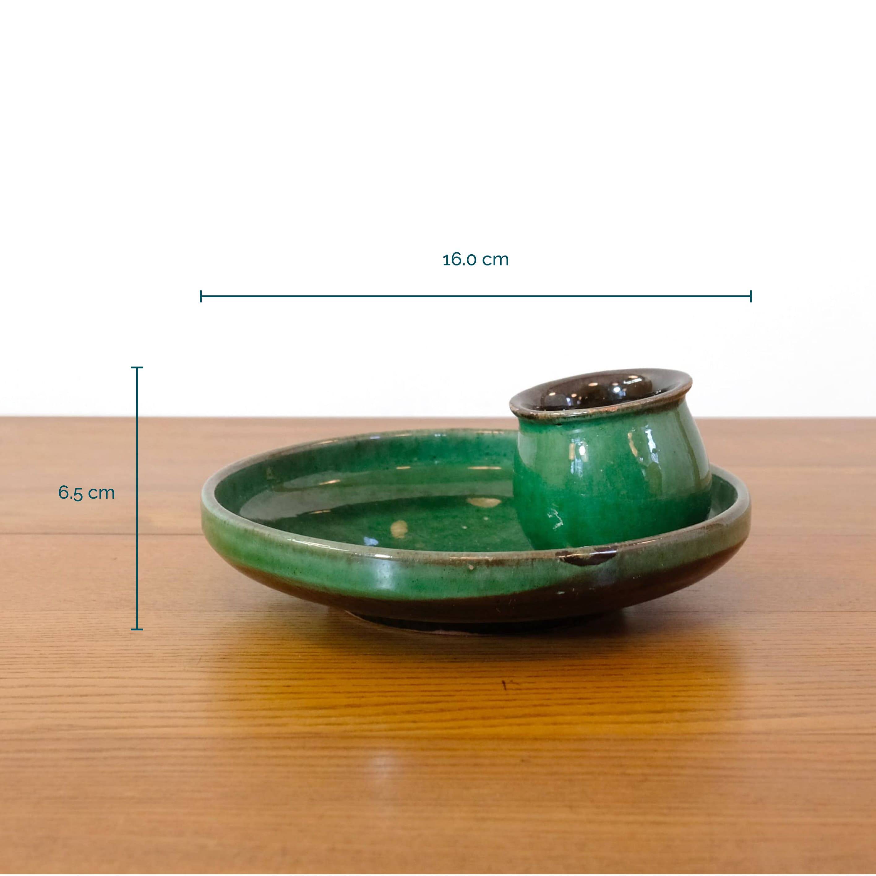 Glazed green earthenware candlestick
