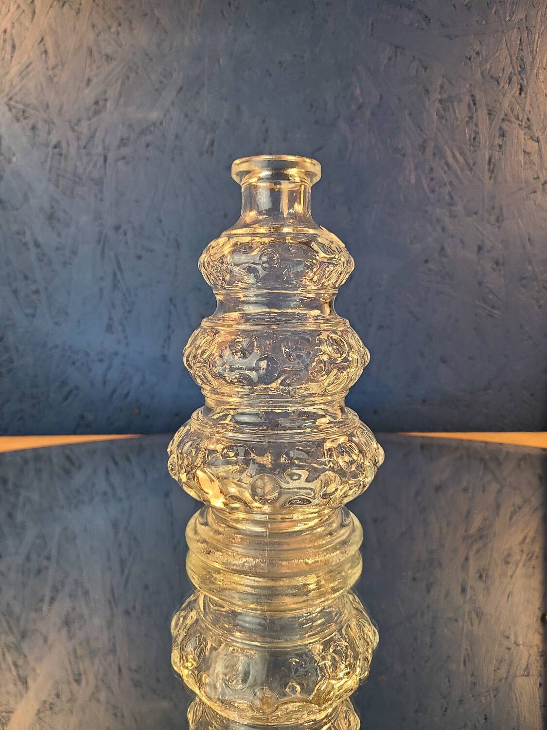 Old 3-branched stone candlestick cut with fine engravings