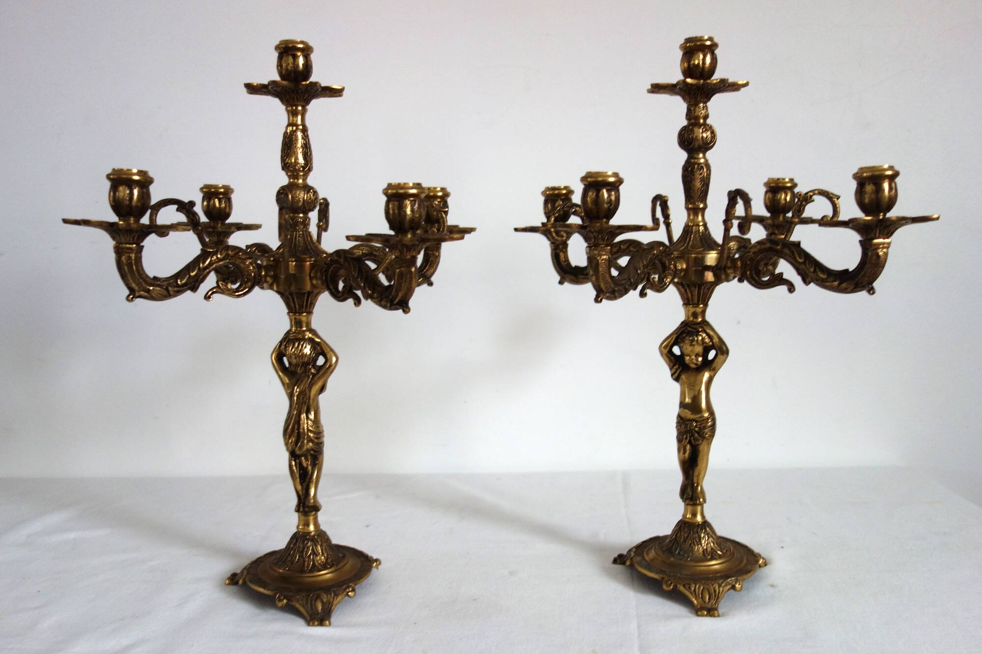 Pair of cherub candlesticks in gilded bronze early 20th century