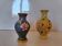 Set of 2 ancient Asian cloisonné vases encircled with brass.