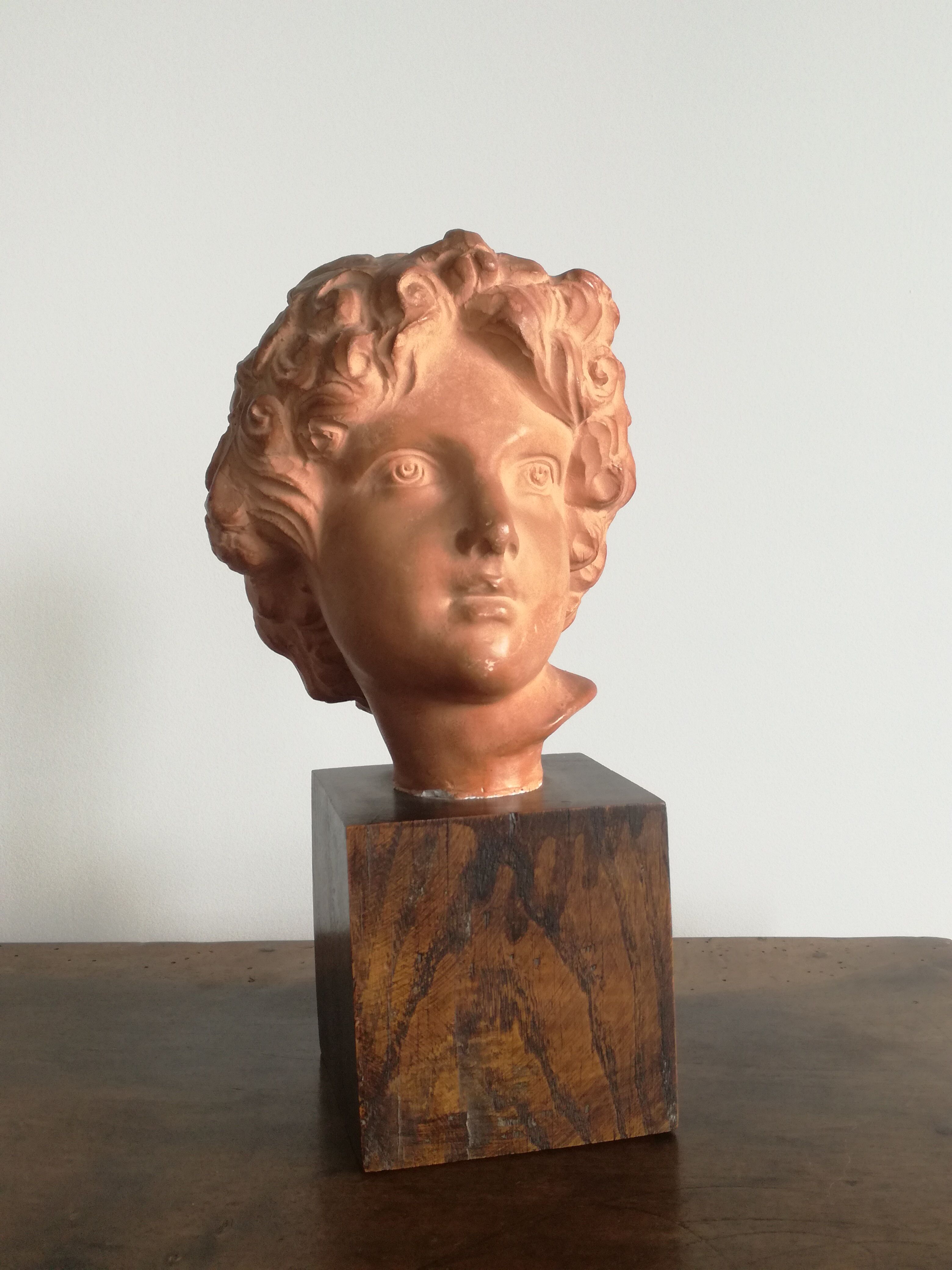 Ancient cherub bust on pedestal