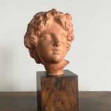 Ancient cherub bust on pedestal
