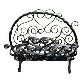 Black wrought iron magazine rack, vintage arabesque patterns