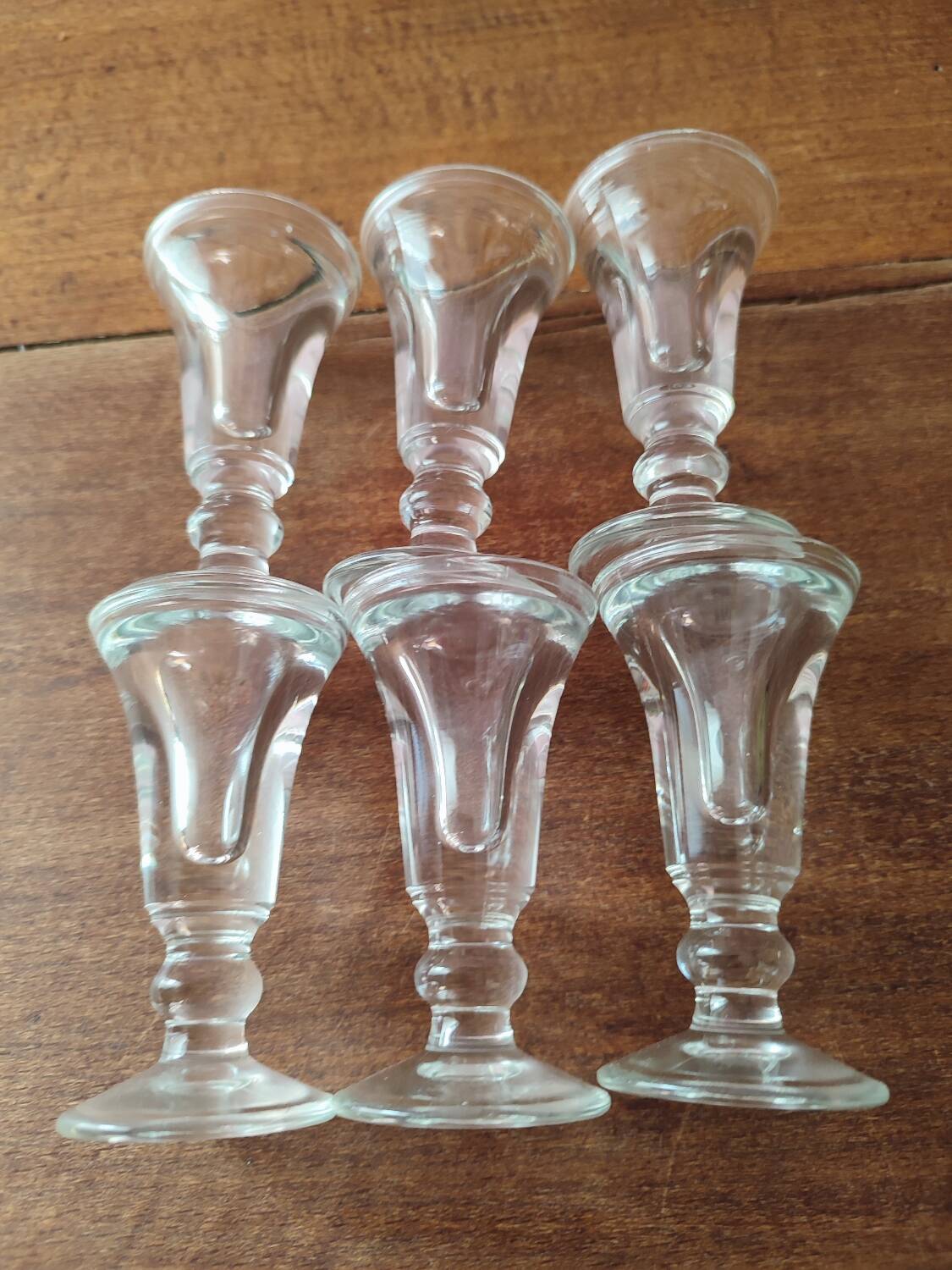Set of 6 antique glasses known as "false bottom" glasses.