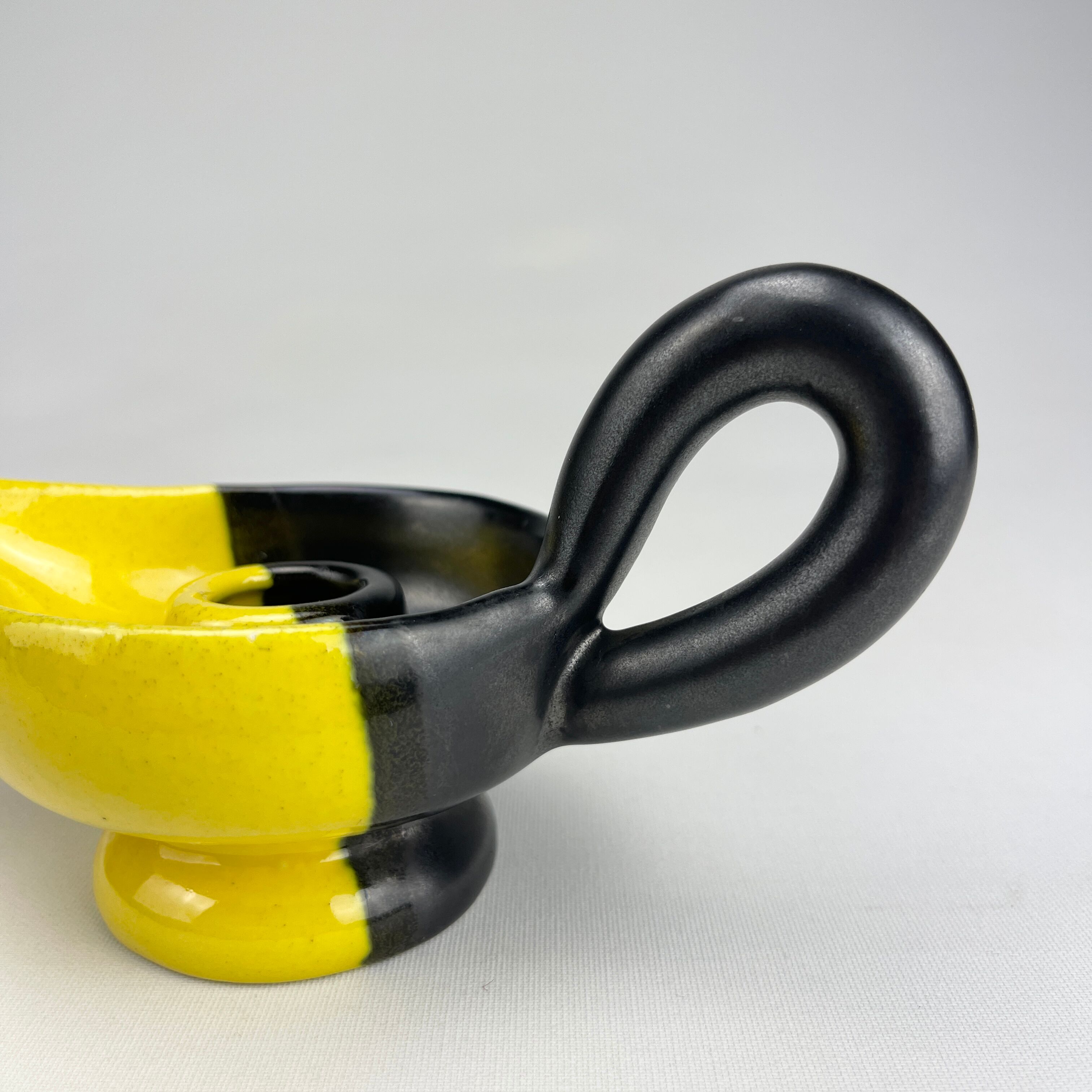 Mid-century yellow and black ceramic cellar rat candle holder