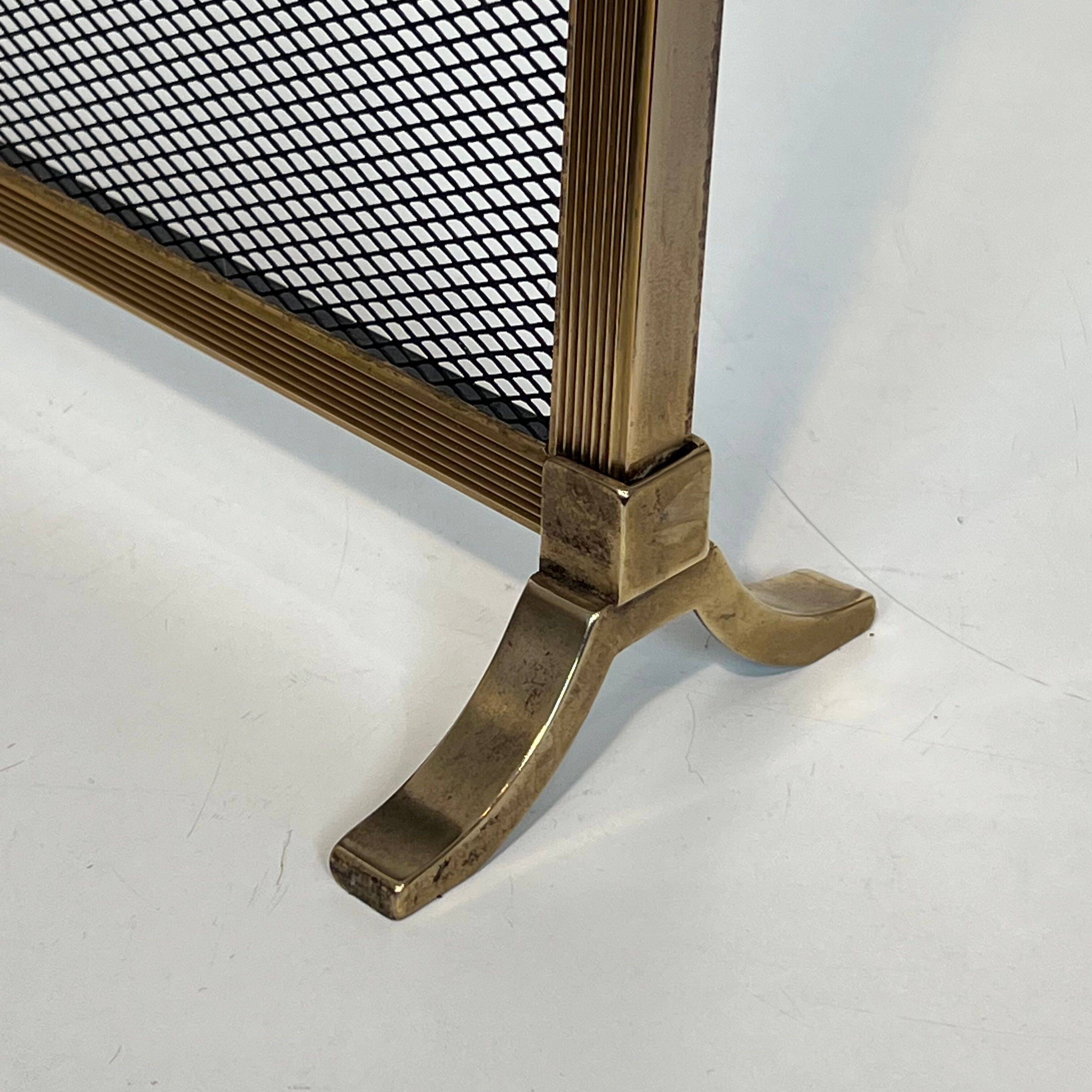 Brass fire screen and grille in the Louis XVI style in the taste of Maison Jansen.