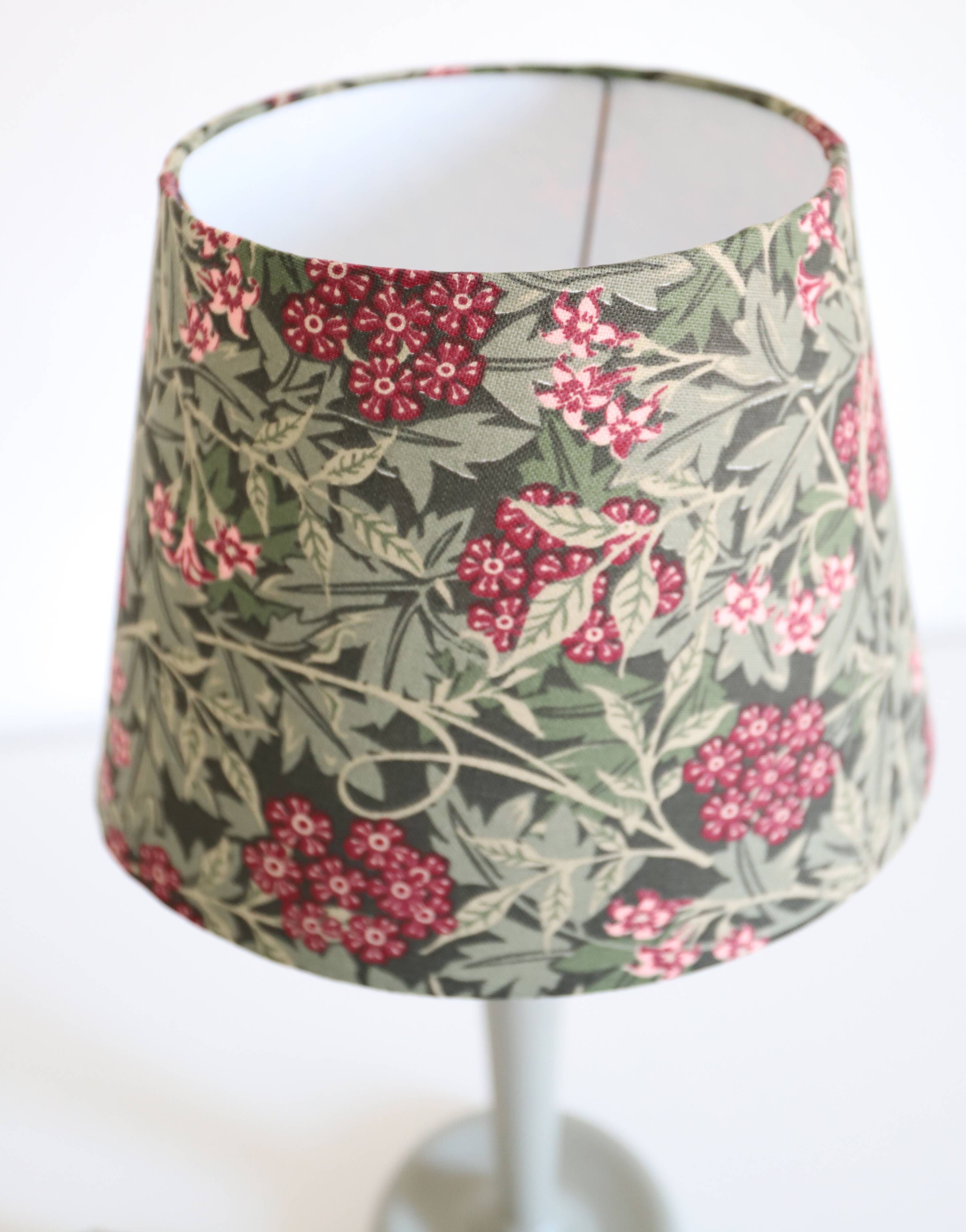 Table lamp, turned wooden base and antique printed lampshade