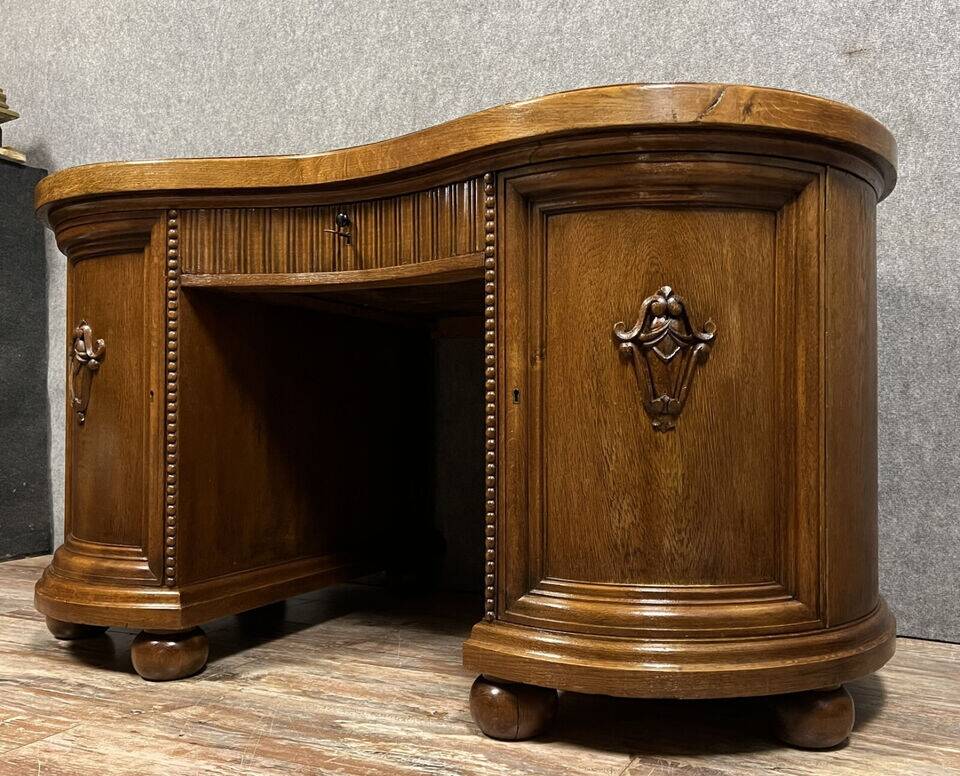 Art Nouveau period bean-shaped oak and walnut center desk