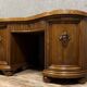 Art Nouveau period bean-shaped oak and walnut center desk