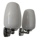 Chrome and opaline wall lights from the 70s.
