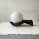 Vintage table lamp hand-crafted in bronze with an opaline globe, Maison Arlus 1970.