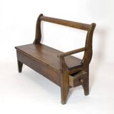 Handcrafted wooden bench with armrest and left drawer.