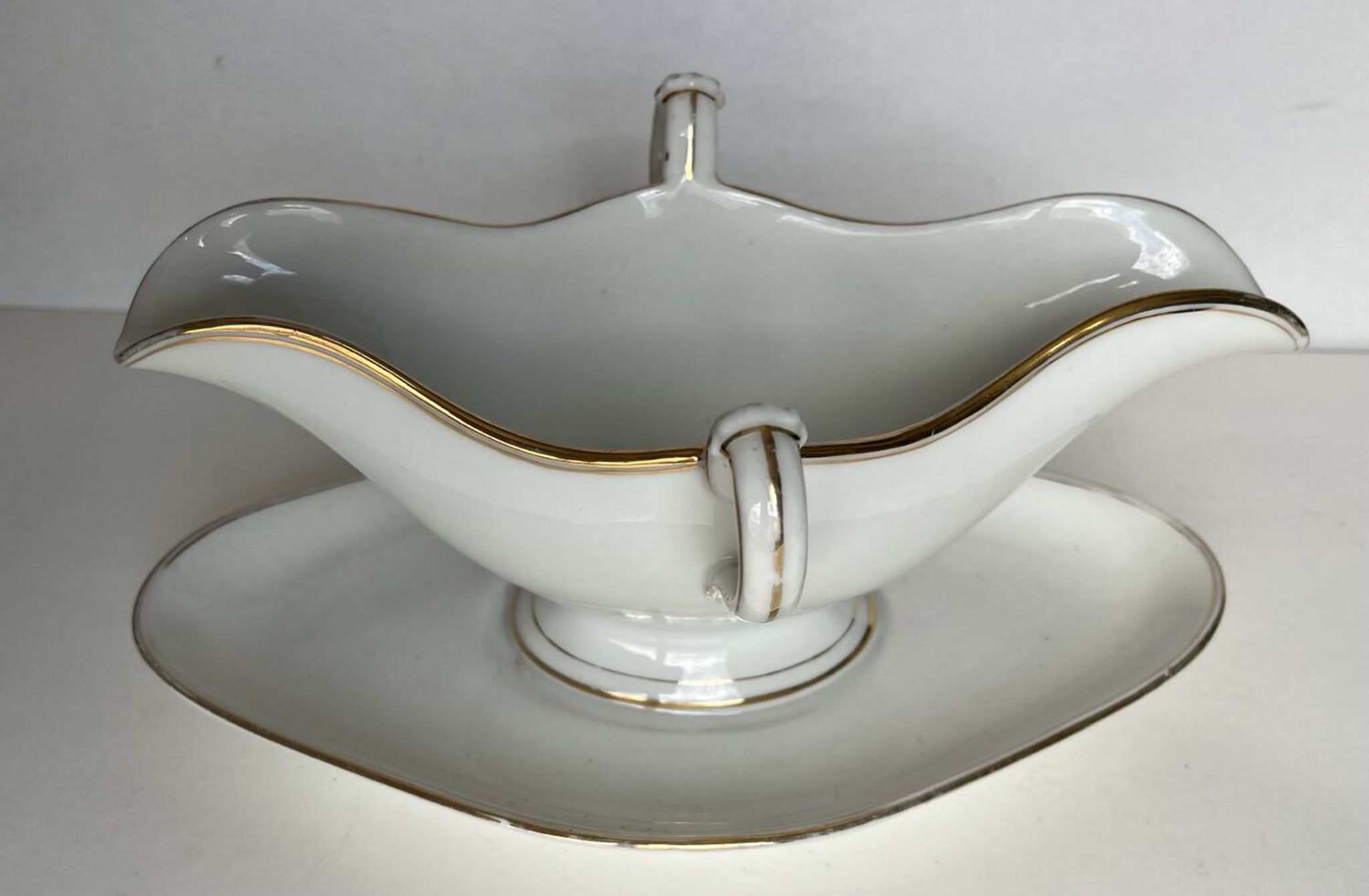 Saucière ancienne en porcelaine de Paris