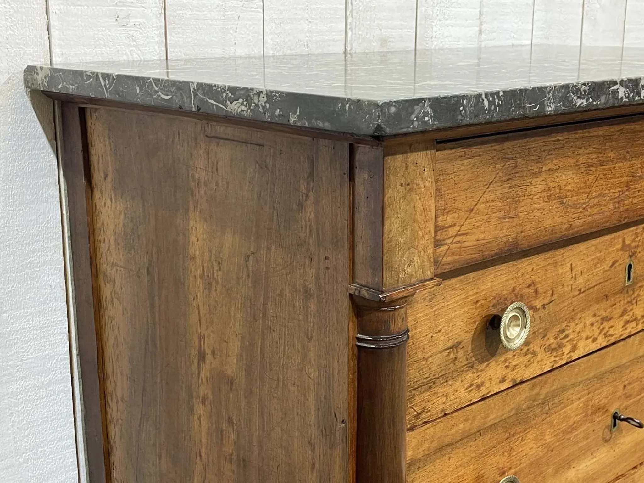 19th-century Empire commode in walnut with a grey St Anne marble top.