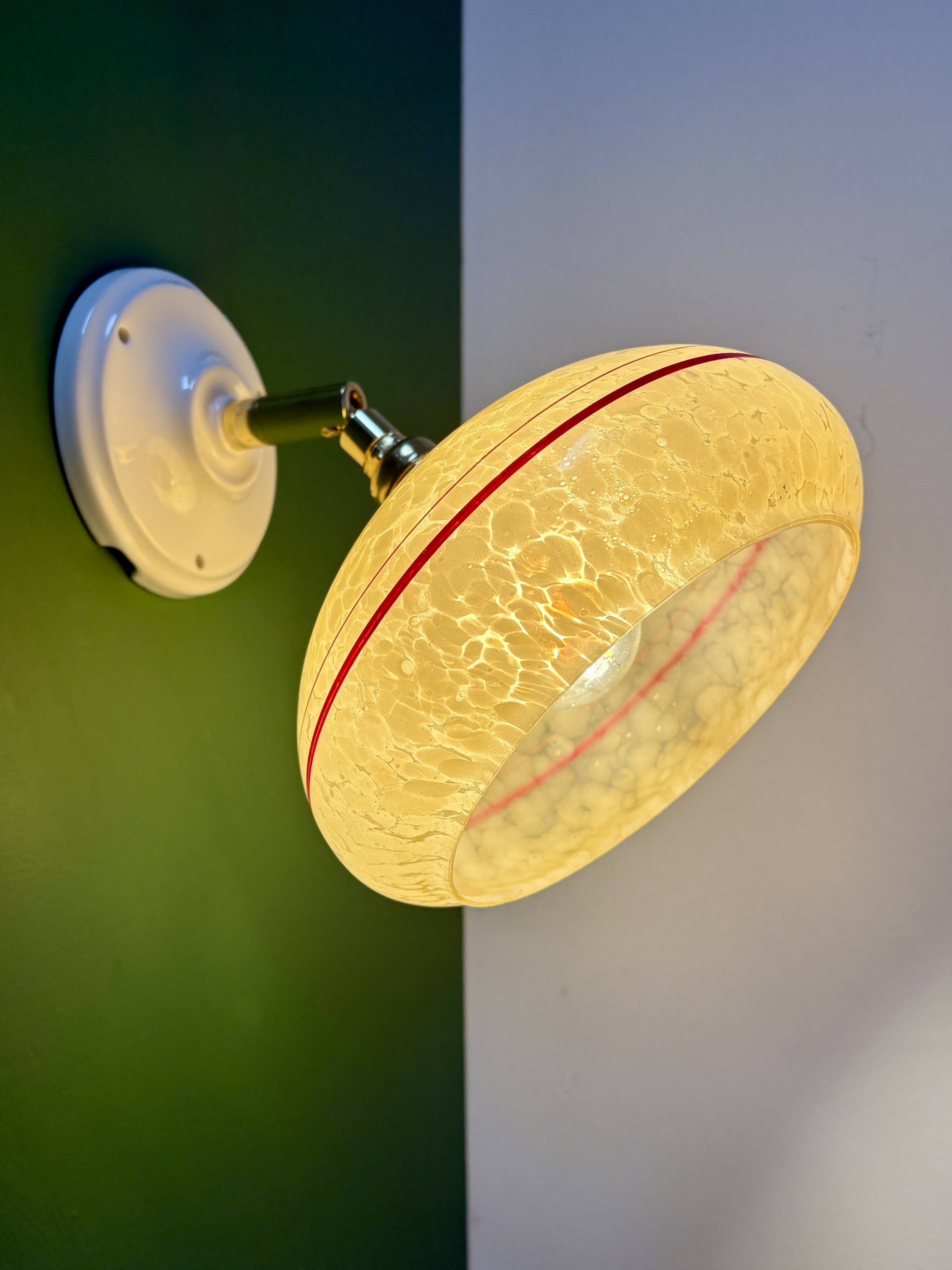 Vintage wall lamp with yellow clichy glass shade and red trim