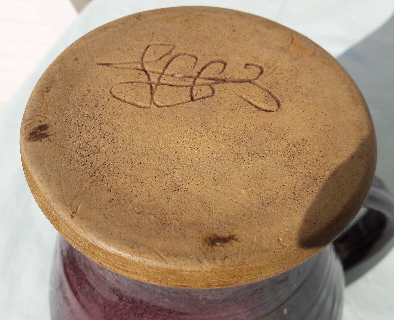 Signed ceramic pitcher