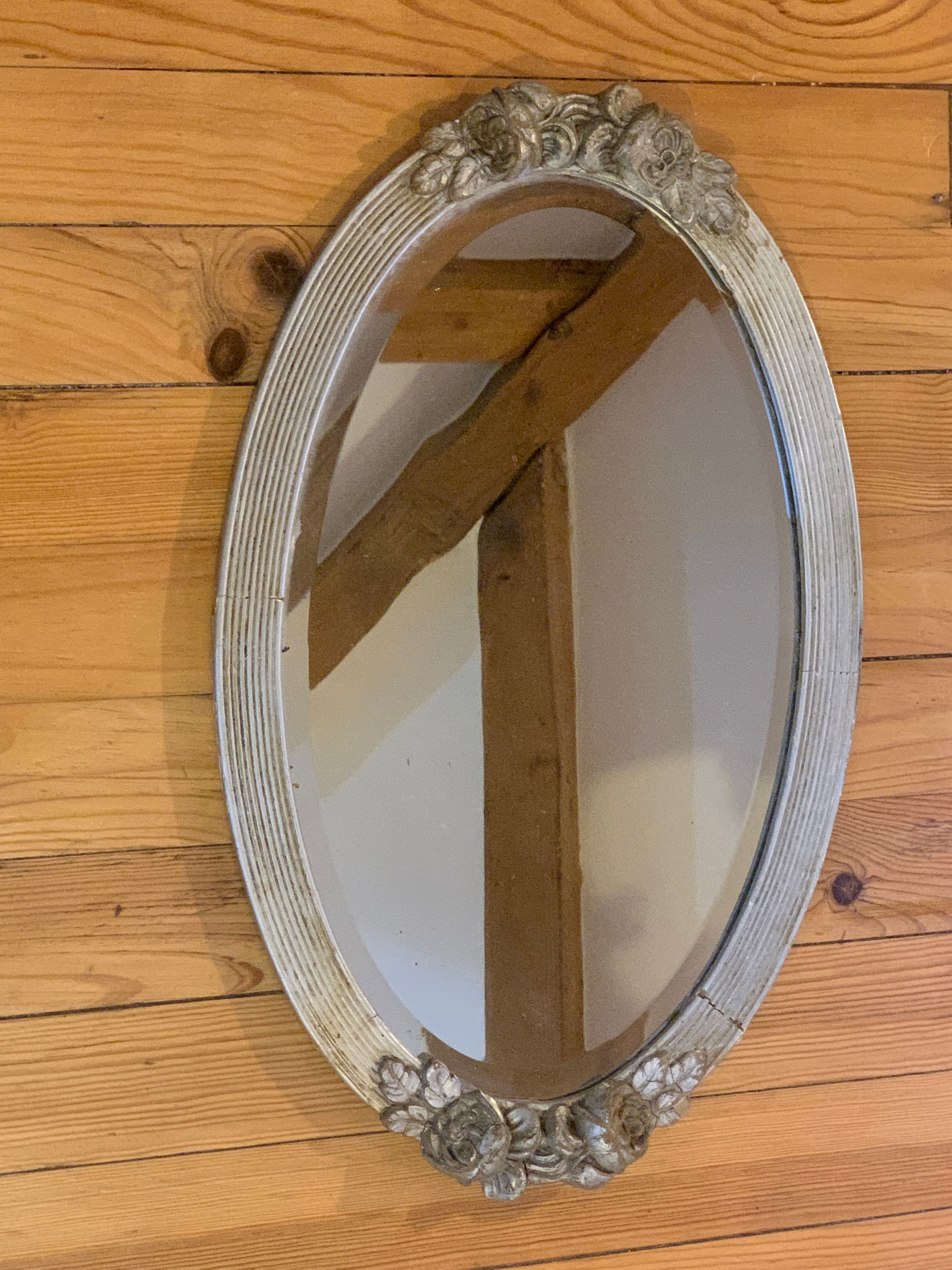 Very old mirror, flower motif frame