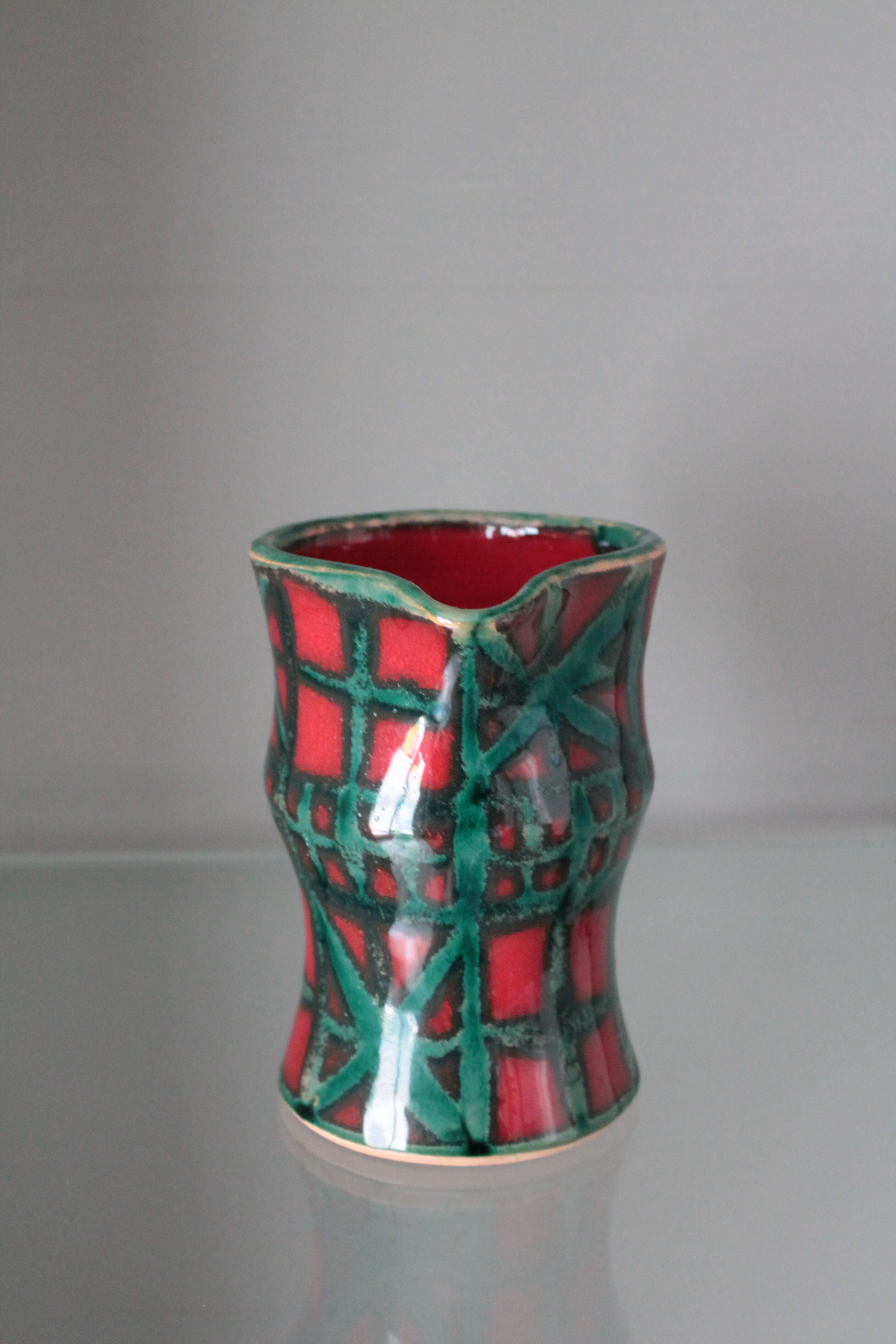 Vintage pitcher red and green art pottery
