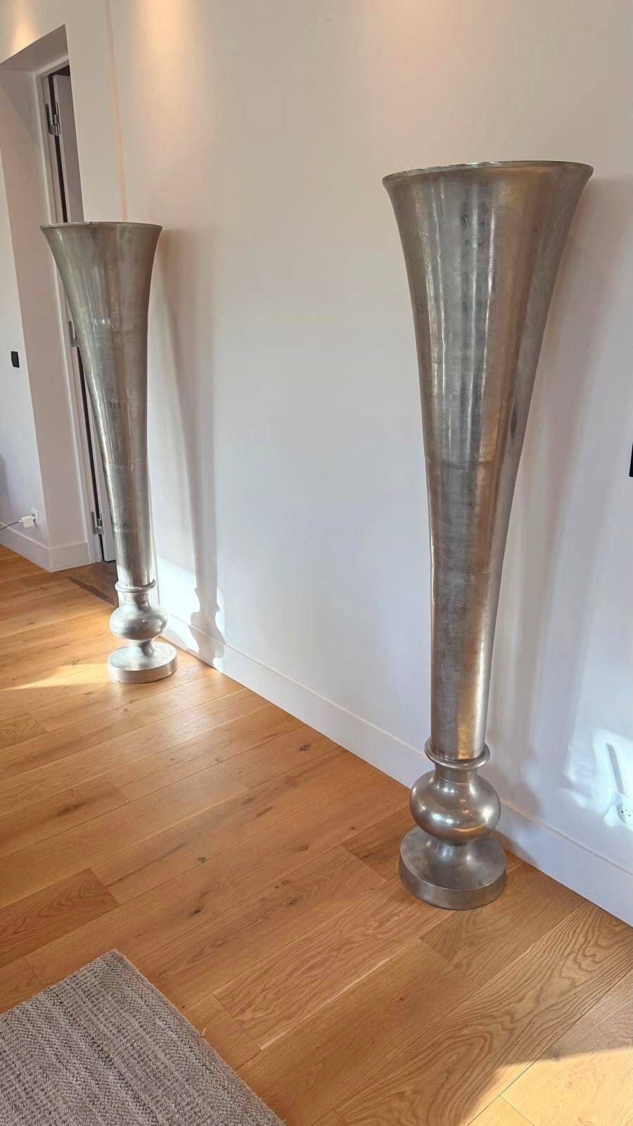 Pair of large silver-plated vases on a stand from Maison de la Literie, 165cm.