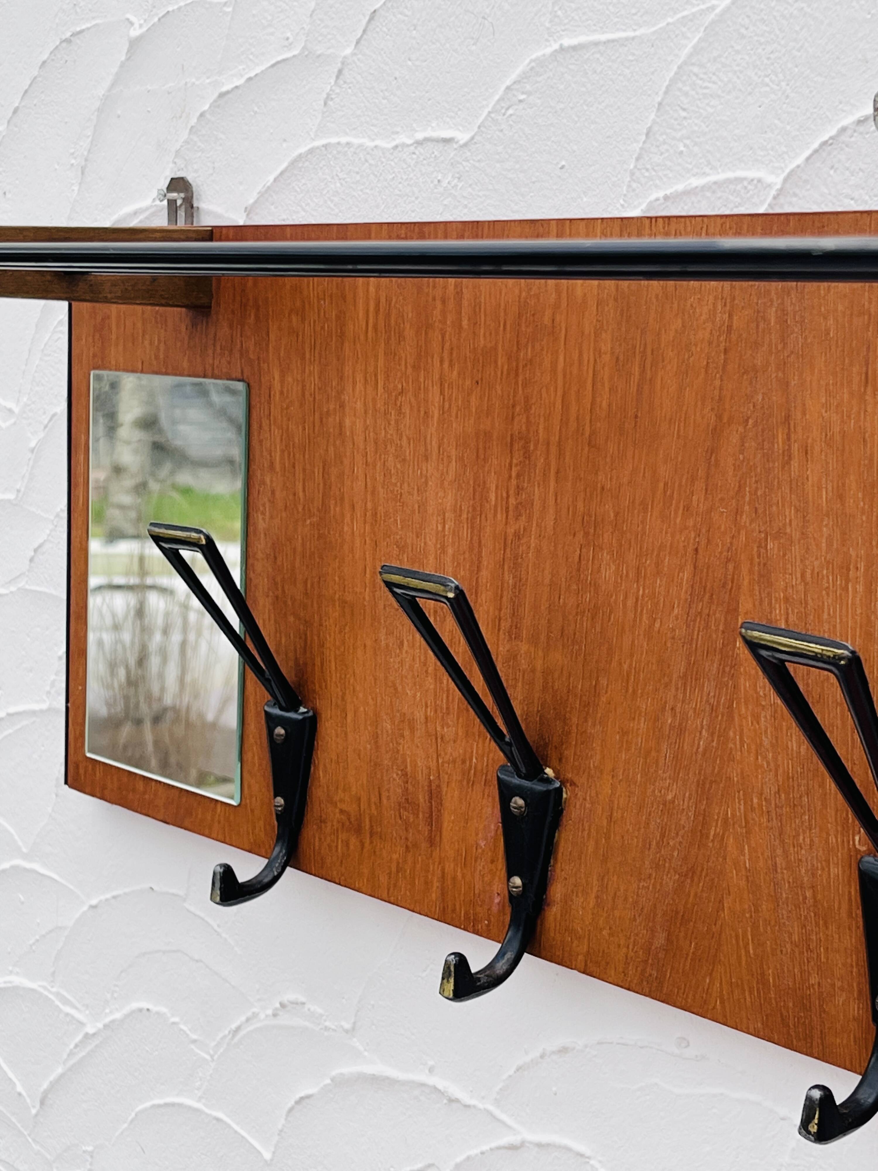 Vintage wooden wall coat rack mirror from the 1960s.