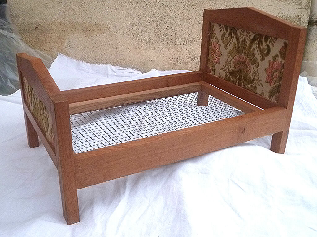 Vintage handcrafted wooden doll bed