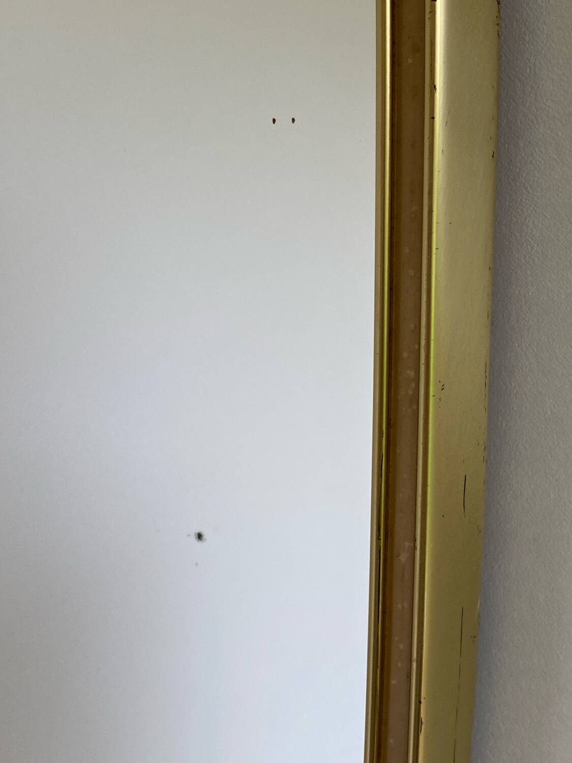 Vintage brass mirror in rear-view mirror shape