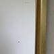 Vintage brass mirror in rear-view mirror shape
