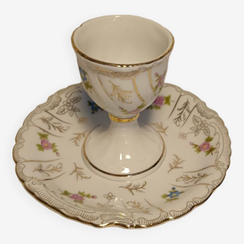 Royal porcelain egg cup with flowers and gilding