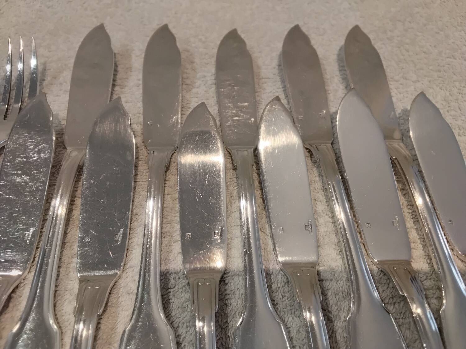 11 silver-plated fish forks and 11 fish knives by Christofle Vendome