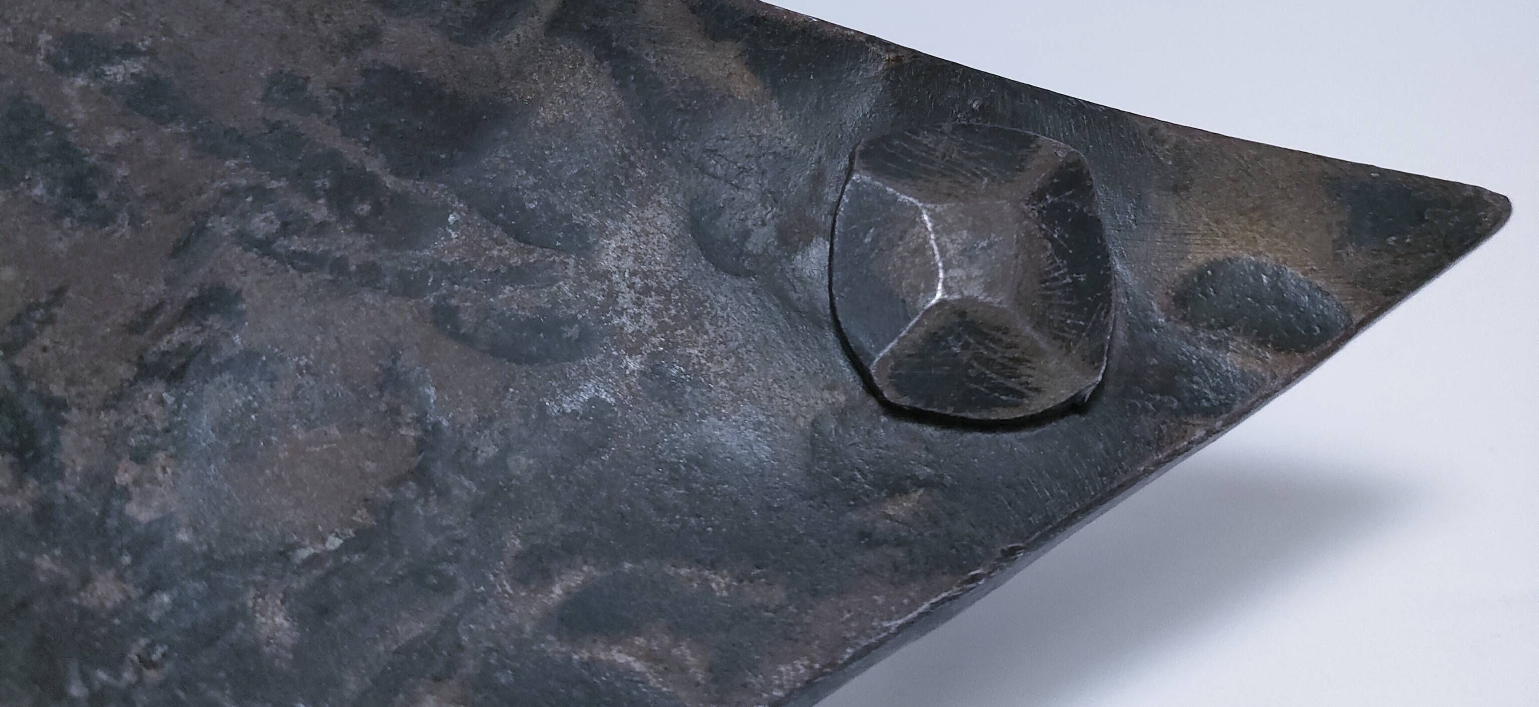 Brutalist metal pocket with patinated tripod