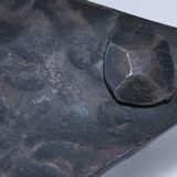 Brutalist metal pocket with patinated tripod