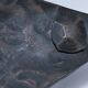 Brutalist metal pocket with patinated tripod