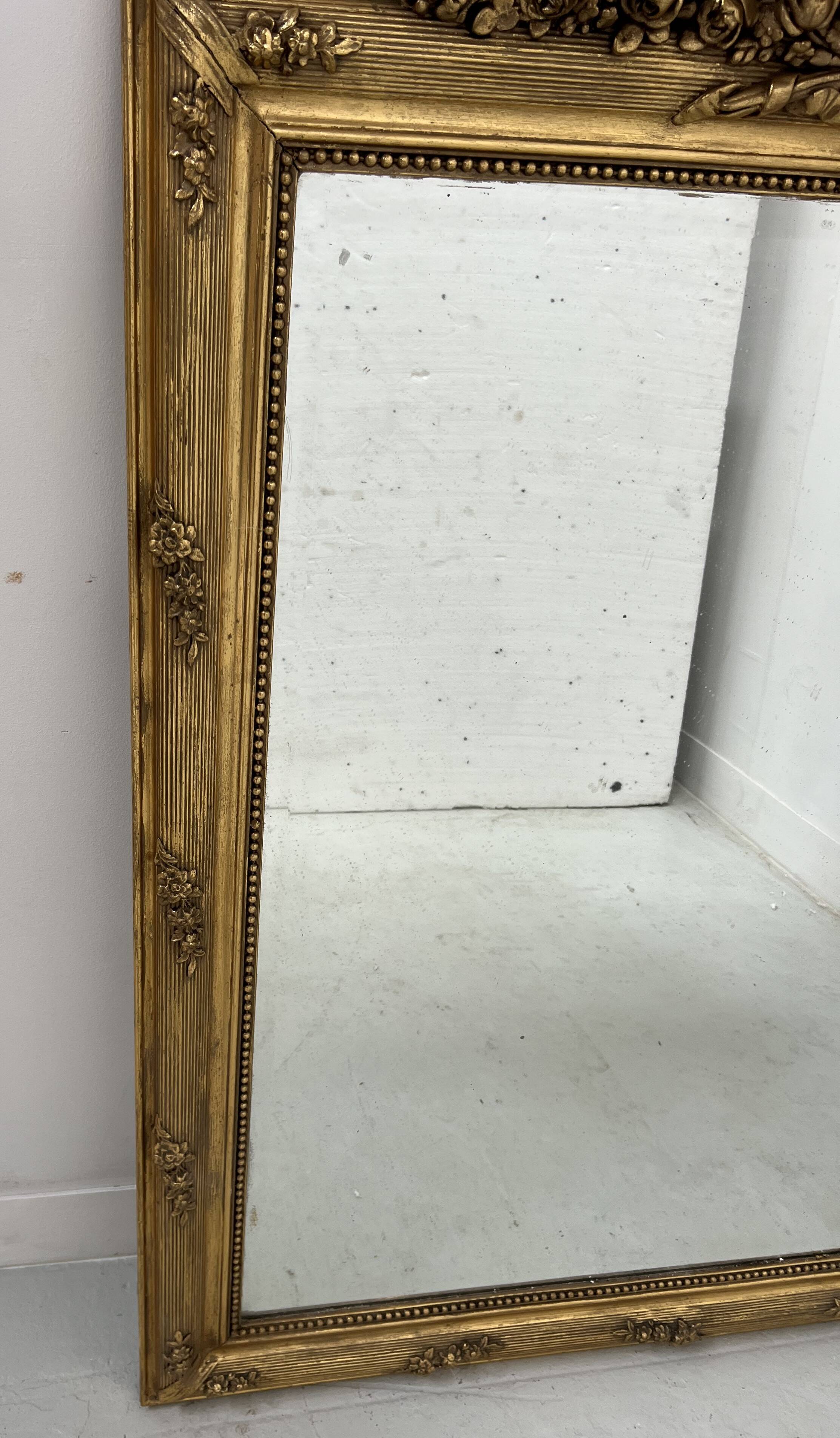 Louis XVI style mirror in wood and gilded stucco, 19th century