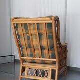 Vintage armchair in bamboo and rattan with a tartan pattern.