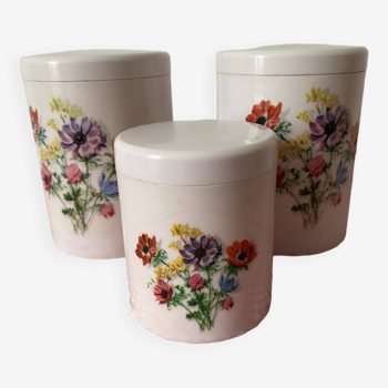 3 vintage plastic storage jars with floral designs