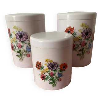 3 vintage plastic storage jars with floral designs