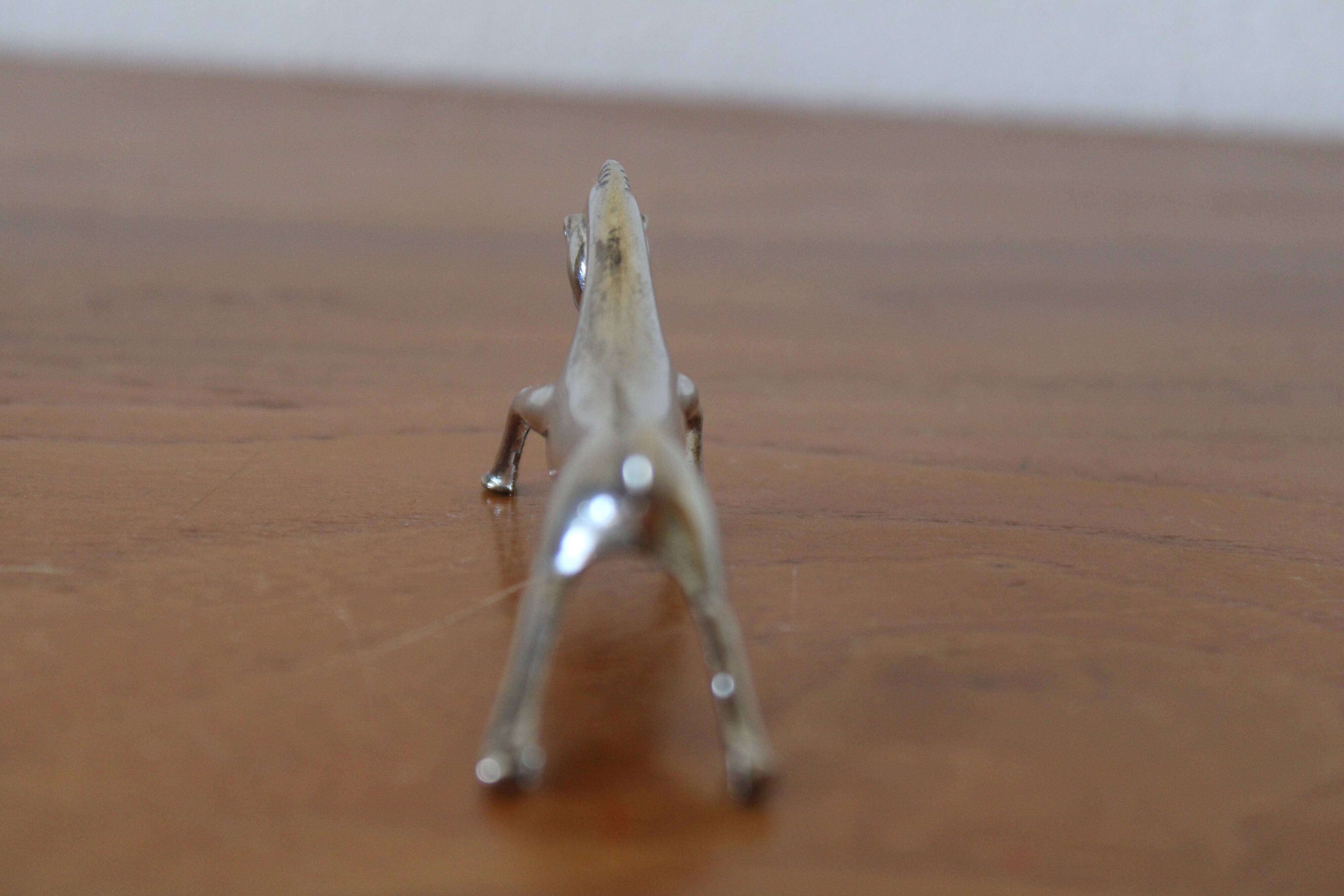 Set of 12 vintage knife rests, in silver metal