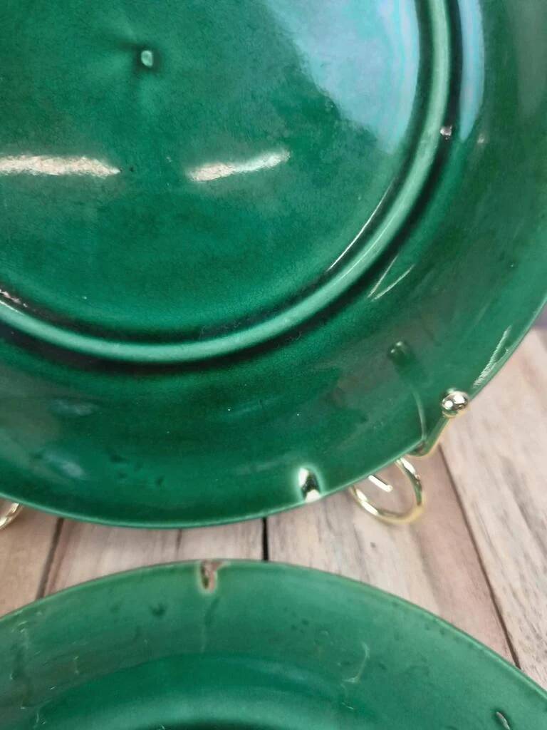 Set of 2 green earthenware dessert plates with vine decoration.