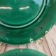 Set of 2 green earthenware dessert plates with vine decoration.