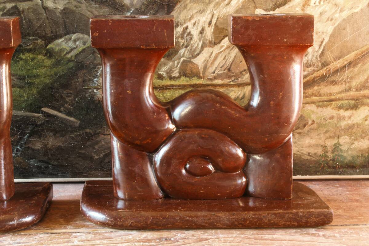 Pair of Art Deco carved wood candlesticks, signed Delaporte