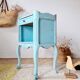 Small vintage bedside table in azure blue patina.