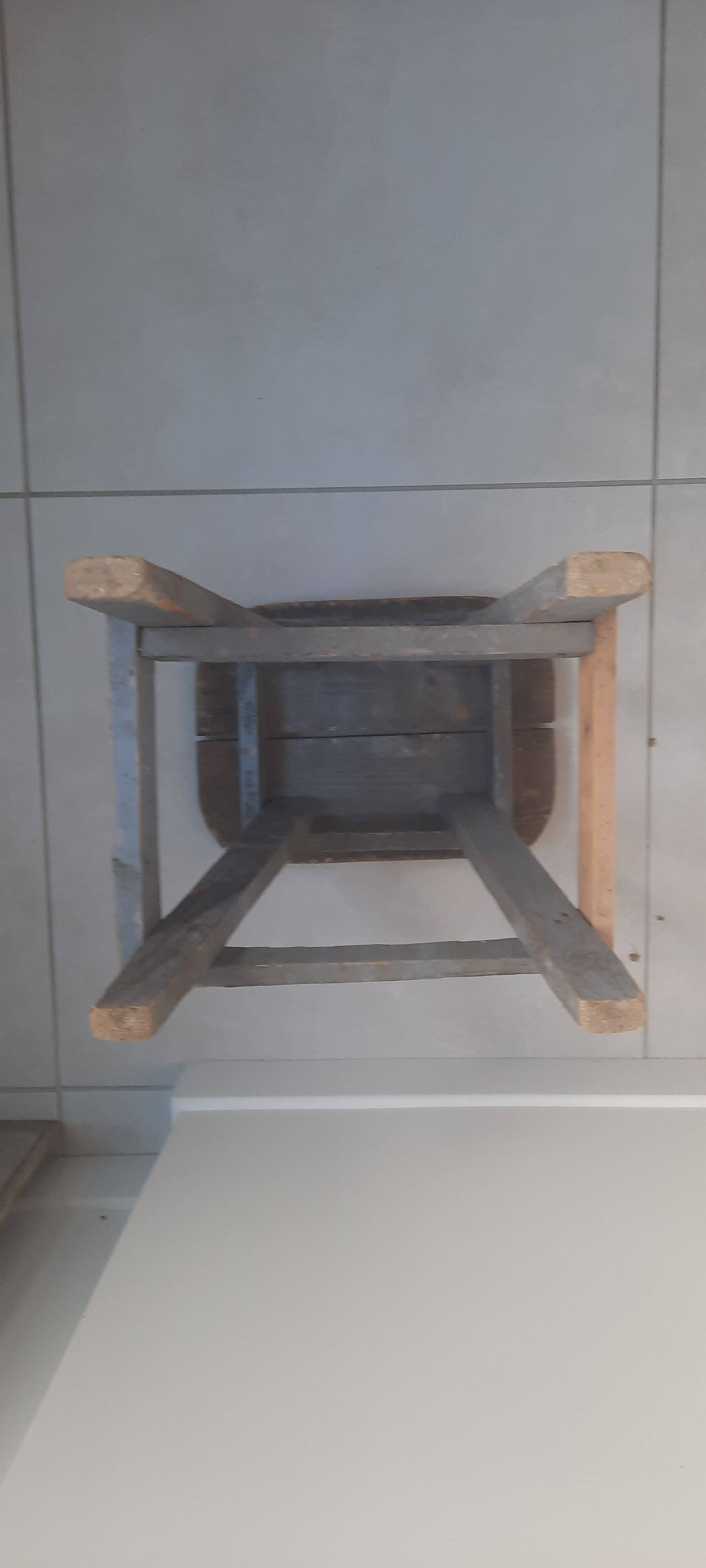 Antique wooden stool in the brutalist style