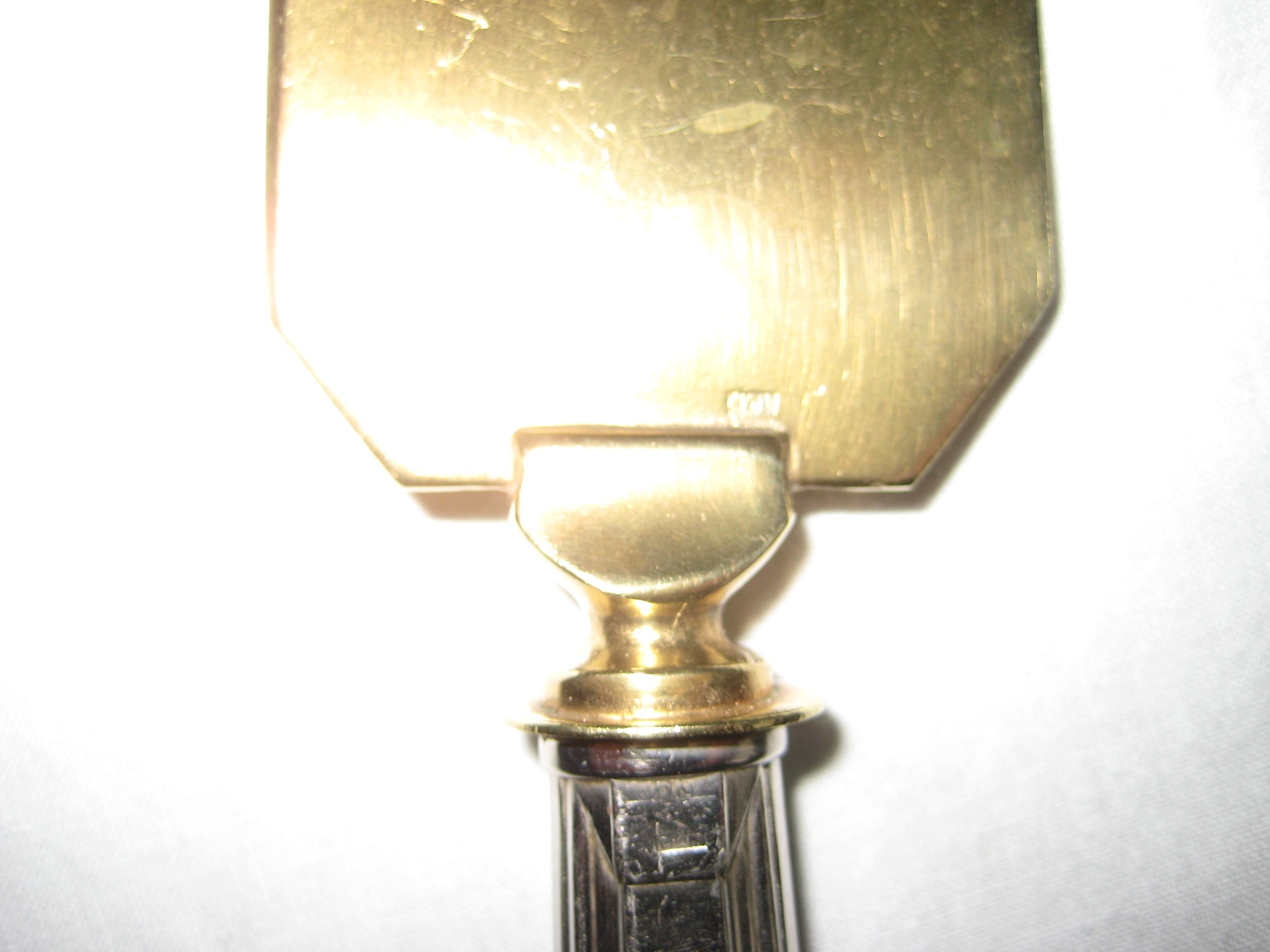 silver metal knife and cake shovel