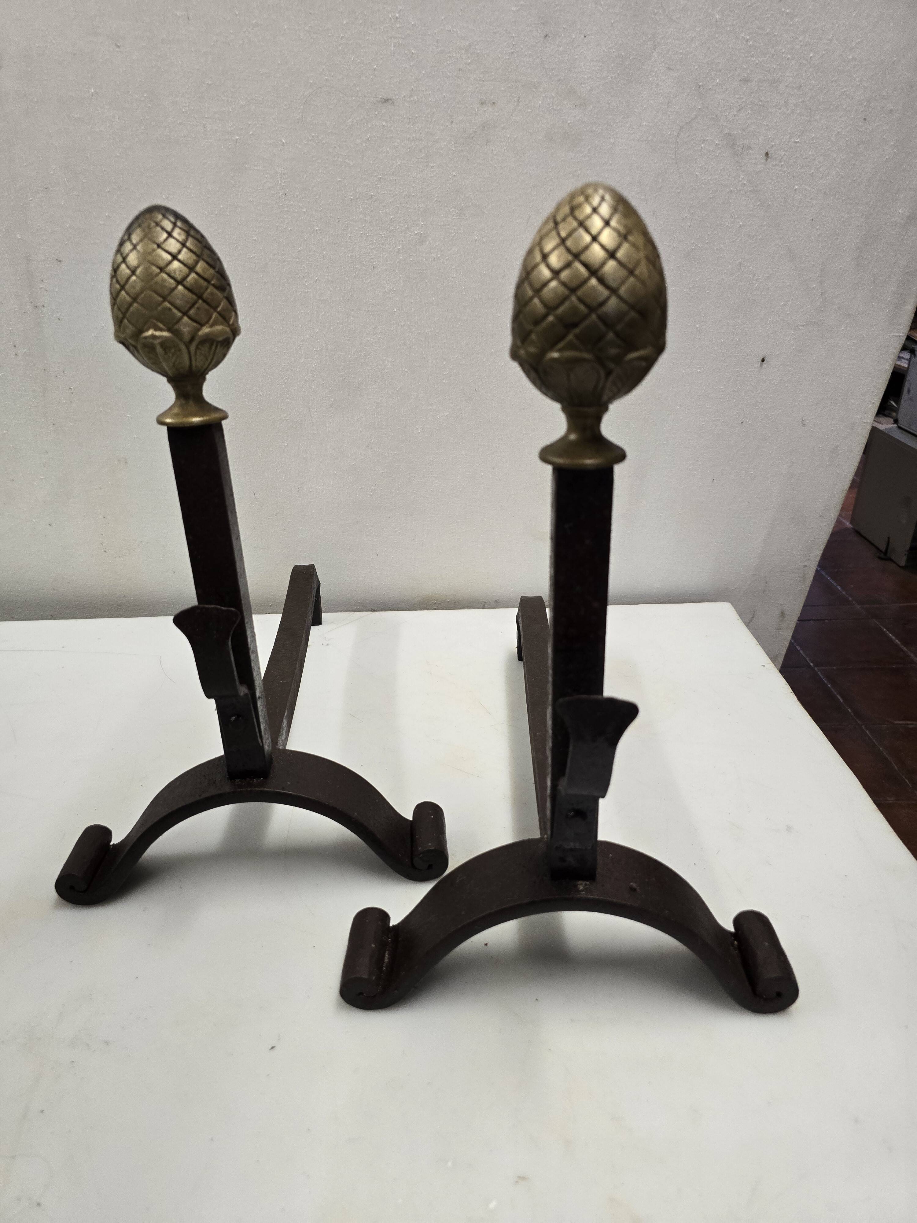 Old pair of wrought iron and bronze andirons