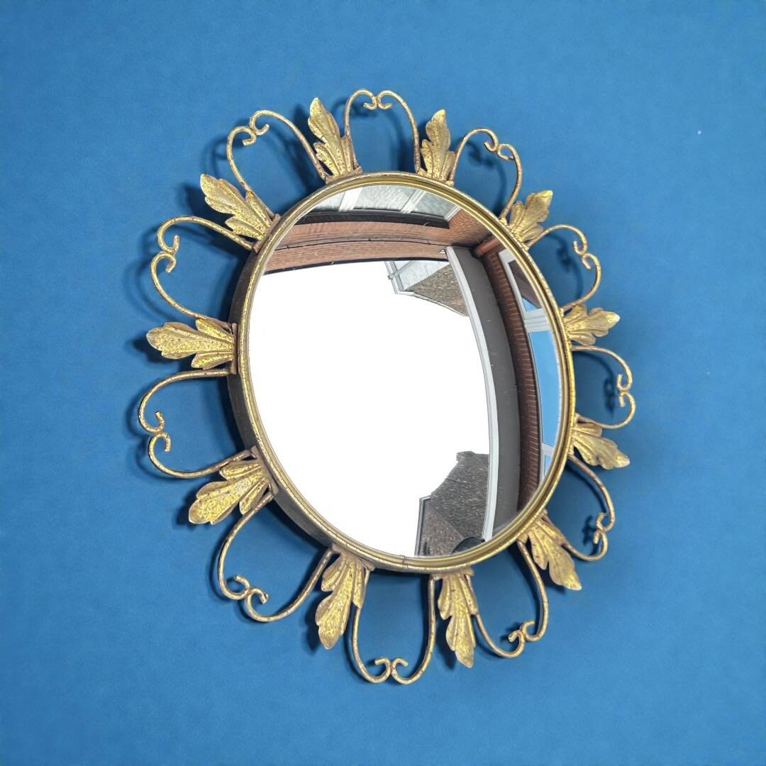 Circular gold metal mirror with floral decoration – 1960s