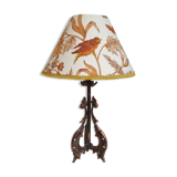 Rock-style table lamp with its vintage bird pattern shade